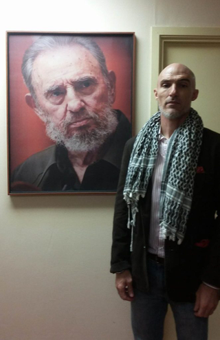 José Perez, 47, a Cuban-American activist, scholar, writer and Castro supporter, pays his respects at the Cuban Permanent Mission At United Nations in New York City (Dec. 3, 2016).